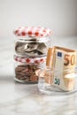 3 glass jars with Euro notes, 2Ã¢âÂ¬ coins and loose cash for housekeeping and savings